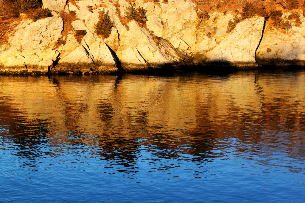 Fort Wetherill rocks and reflection